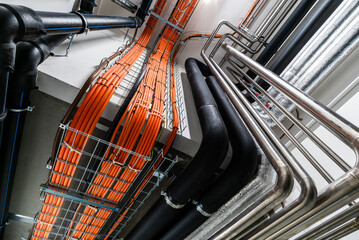 Industrial cable trays with organized electrical wiring installation © Forance