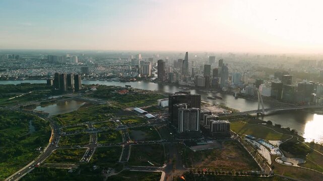 Aerial view of ho chi minh city, vietnam, featuring saigon river at sunset
