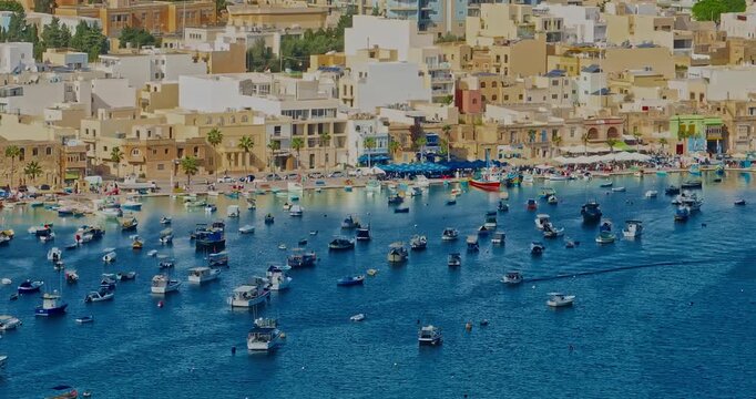 Aerial view of the Port of Marsaxlokk In Malta. A small fishing village with traditional colorful boats