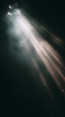 Sunlight streams through dark water creating ethereal beams and illuminating small particles floating