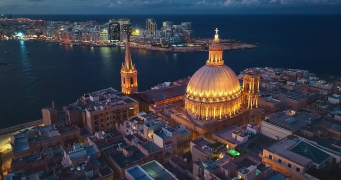 Aerial view of amazing evening night view of church dome in Valletta city. Malta island