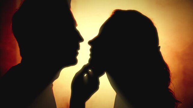 portrait unrecognizable black silhouette happy romantic couple together portrait man kissing sexy young woman. Adult girl hugs guy beauty face lips. fantasy night room hot orange fire divine light 4k