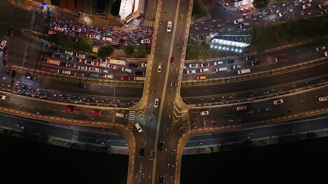Night traffic of ho chi minh city, aerial view street with cars and motorbikes driving at rush hour in vietnam