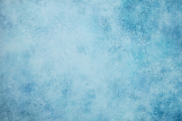 Obraz premium Elegant light blue textured surface with subtle imperfections. Abstract background with muted texture. Great for moody visuals. Top view. Copy space.