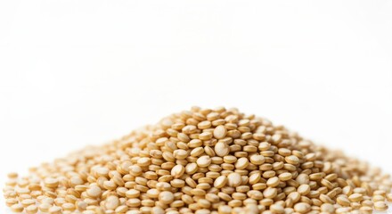 Isolated pile of uncooked quinoa seeds against a pure, soft, clear ambience on flat lay panorama.