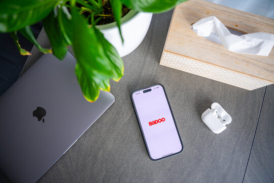 Prague, Czech Republic - February 19, 2026: Smartphone with Badoo app open placed on desk in home interior. Online dating application and contemporary digital connection concept