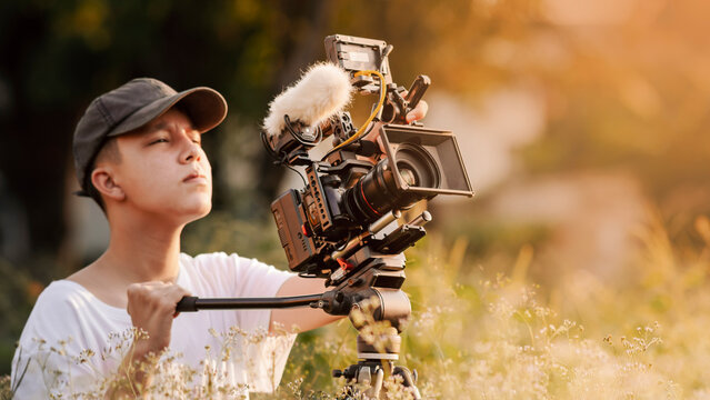 young filmmaker. operate a digital camera to tell the story in a new movie or documentary. social content creator.
