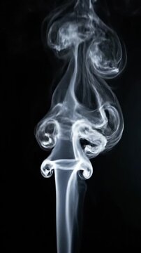 A stream of smoke rising forms a woman's silhouette against a dark background, suggesting freedom or empowerment