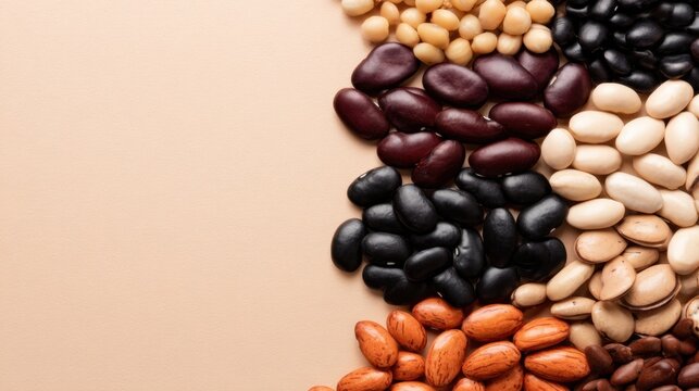 A variety of colorful beans scattered artistically on a soft, neutral background