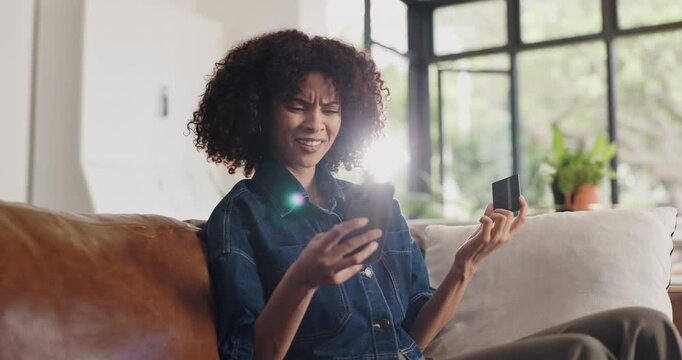 Confused, woman and credit card in home with phone, decline payment and online shopping problem. Frustrated, person and fintech issue on sofa with digital banking error, ecommerce challenge or flare.