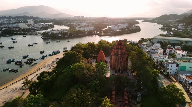 Drone view of the historic cham towers in nha trang, vietnam with the cityscape in the background