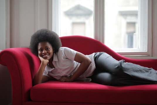 woman lying on a sofa