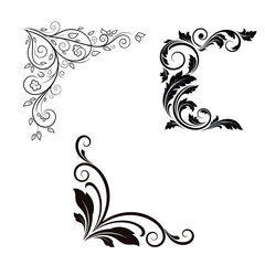 Fototapeta premium Black floral corner border designs with leaves and swirls