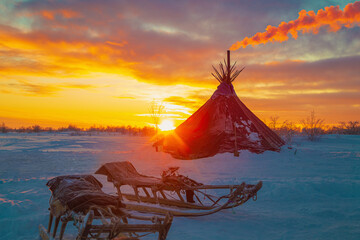 Traditional dwelling of Nenets reindeer herders, chum, at sunset. © lizavetta