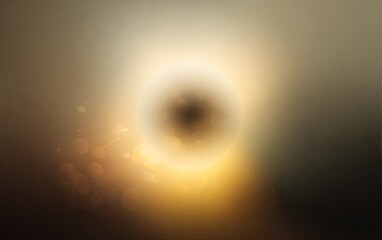 Obraz premium Luminous orb with glowing halo against a gradient background of light and shadow