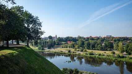 Fototapeta premium High angle view of the city park Grodno and river under a blue sky
