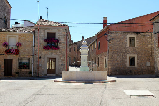 Entering Rab&eacute; de las Calzadas with old buildings, Parroquia de Santa Marina tower, and fountain 2024