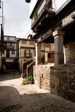 Narrow street with traditional stone buildings.. Mogarraz, in the Sierra de Francia (Salamanca)