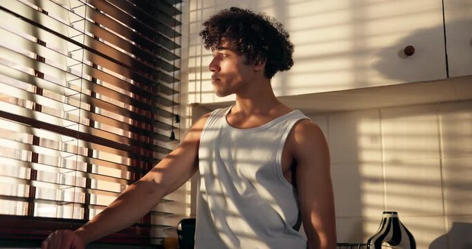 Thinking, sad and man in home by window with disappointment, failure and upset in morning. Kitchen, mistake and person with thoughtful, reflection and worry for job loss, unemployment and burnout
