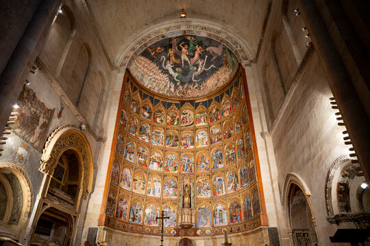 Colorful altarpiece inside an old cathedral.. main altarpiece of the Old Cathedral of Salamanca