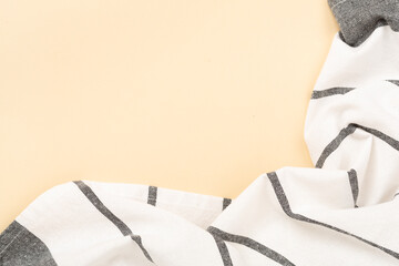 Kitchen napkin on color background, top view