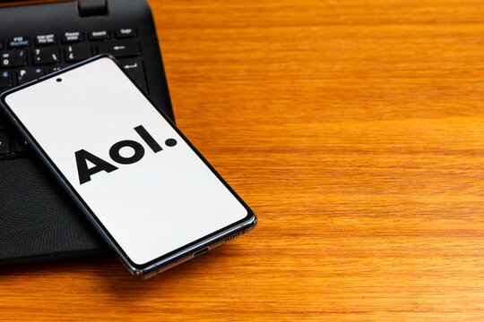 Punta Arenas, Chile &ndash; February 23, 2026: A close-up of a mobile phone showing the rebranded AOL brand icon logo, placed on a laptop keyboard