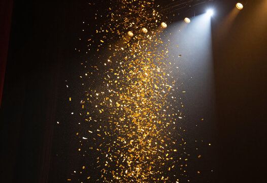 burst vibrant golden confetti explodes bright spotlight showering darkened stage delicate intricately cut paper fragments