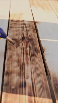 Wood Burning Process With Torch On Deck Boards, Exterior Wood Treatment For Renovation And DIY Content
