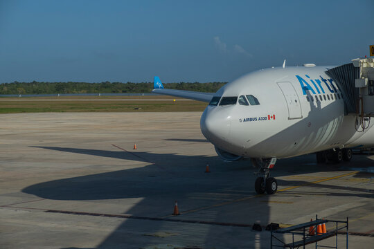 Close view of AirTransat airplane at the gate of an airport before boarding. Varadero International Airport, Cuba.