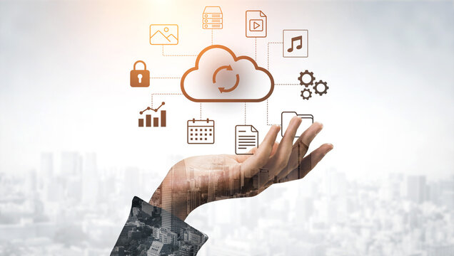 This image showcases a hand reaching towards visually represented cloud storage icons, symbolizing the connection, data management, and technology in the modern business landscape. Gantry