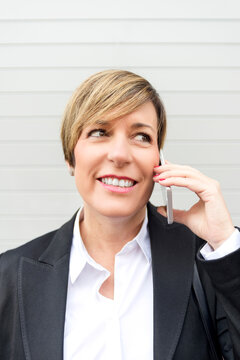 Businesswoman talking on phone close up portrait