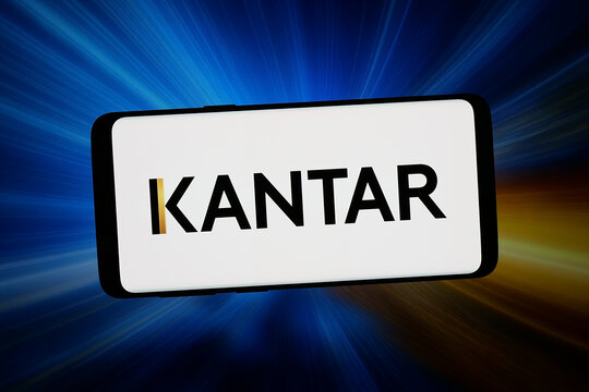 Stuttgart, Germany - 02-16-2026: In this photo illustration, the logo of market research company Kantar Group Ltd. is displayed on a smartphone in front of abstract background on computer screen.