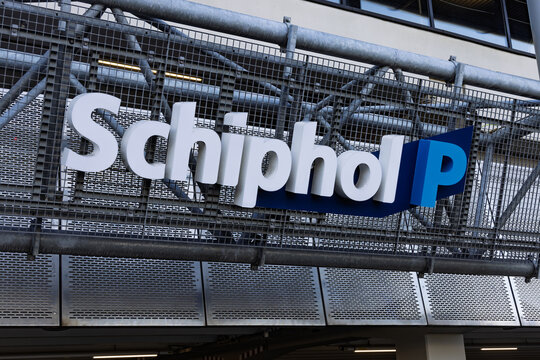 Large "Schiphol P" parking sign at Amsterdam Schiphol Airport. Modern signage for airport parking facilities and infrastructure. Schiphol, Netherlands. 8 February 2026.