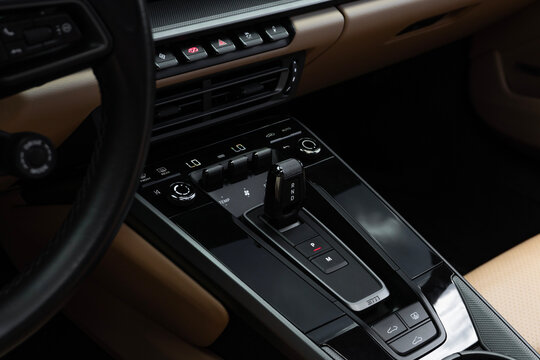 Porsche 911 Carrera center console and gear selector, Luxury sports car interior with climate control buttons
