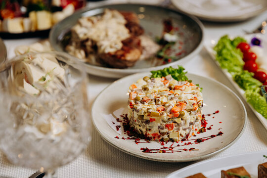 Olivier salad served as festive appetizer on restaurant table