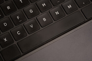 A black keyboard with the letters F, G, H, J, K, L, M, N, O, P, Q, R, S, T, U, V © jr-art