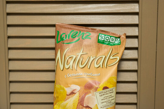 Tyumen, Russia-December 20, 2025: Lorenz Chips package from a snack brand displayed on a wooden surface with plain background