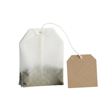 Pristine square green tea teabag with a blank kraft paper tag isolated on a transparent background with copy space. Concept of purity and wellness