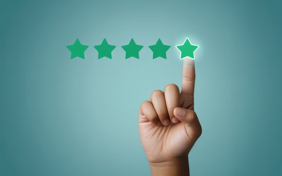 A hand with finger pressing a virtual five-star rating on a blue background from a close-up viewpoint