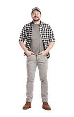 Fototapeta premium Smiling long-haul truck driver in baseball cap and checkered shirt on white background