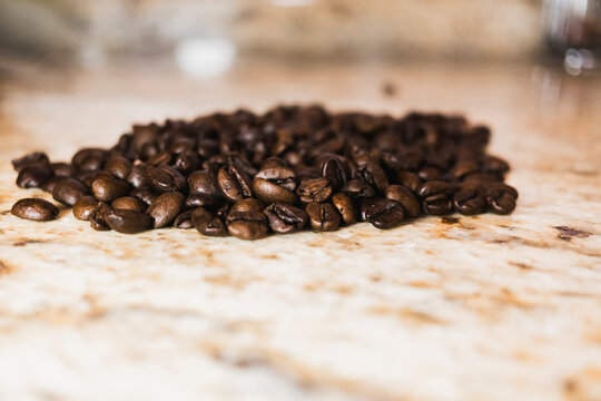 Coffee beans on a marble countertop