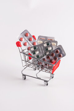 Shopping cart filled with various medicine blister packs
