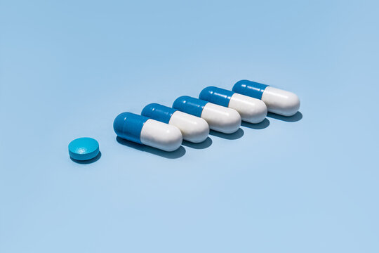 Blue and white capsules with single blue pill