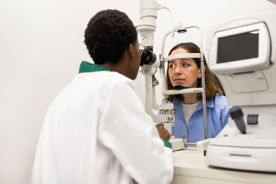 Optician conducting a comprehensive eye examination
