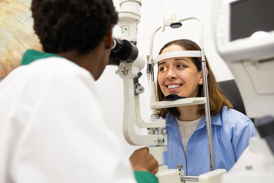 Eye examination by optician using slit lamp