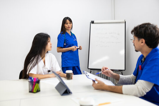 Medical team discussing patient care in meeting
