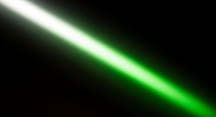 Green light beam on black background