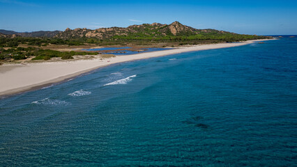 Fototapeta premium Aerial view of Berchida beach with white sand and turquoise waters, Sardinia, Italy.