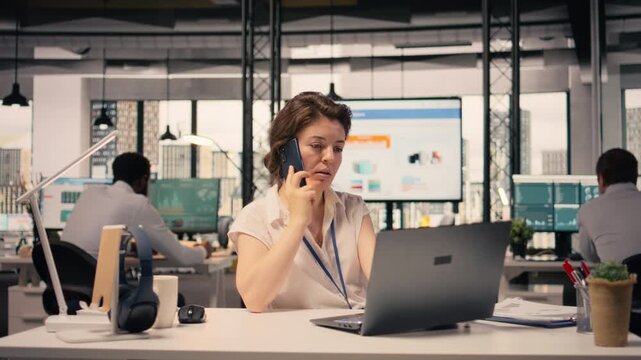 Woman mobile call, remote business discussion, modern office, laptop support, forecasting reports, data analysis and insights, resource allocation, and performance review. Cellular network.