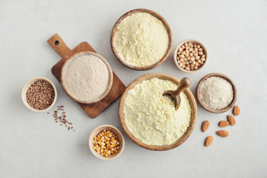 Wooden bowls with different types of gluten free flour